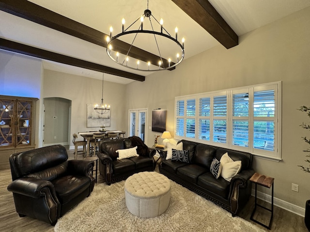 624 Tournament Ln, Freeport, FL 32439 - living room featuring a chandelier, beamed ceiling, wood finished floors, baseboards, and arched walkways