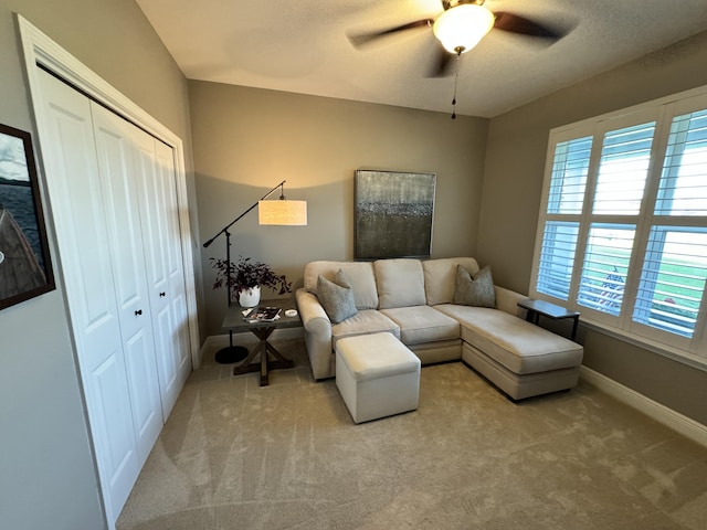 624 Tournament Ln, Freeport, FL 32439 - living area featuring ceiling fan, carpet, and baseboards