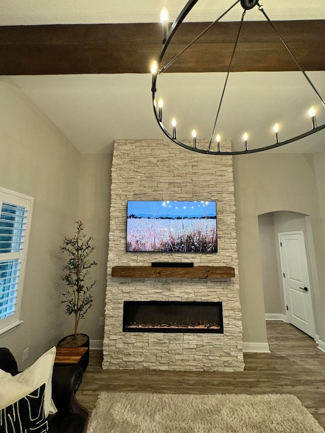 living room featuring a fireplace and wood-type flooring