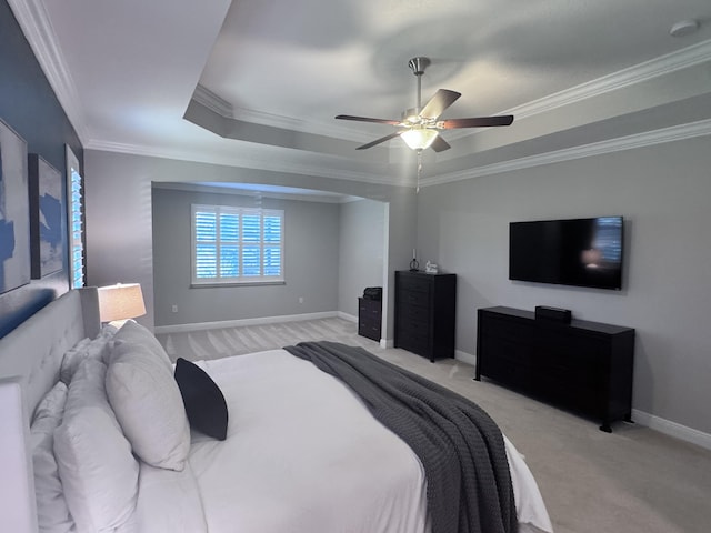 624 Tournament Ln, Freeport, FL 32439 - bedroom featuring light carpet, crown molding, a tray ceiling, baseboards, and ceiling fan