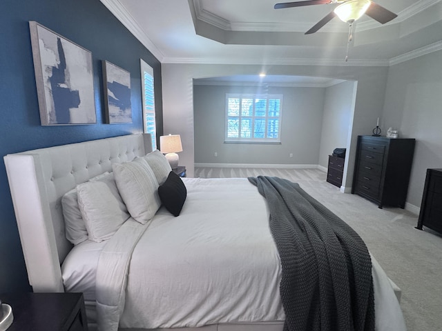 624 Tournament Ln, Freeport, FL 32439 - bedroom featuring a raised ceiling, ornamental molding, light carpet, baseboards, and a ceiling fan