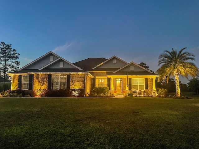 craftsman-style home featuring a yard