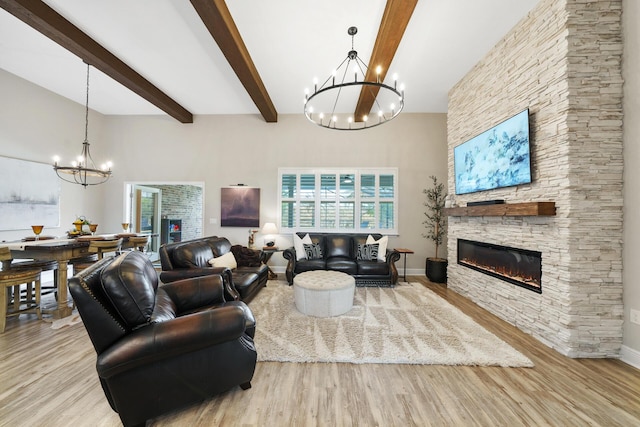 624 Tournament Ln, Freeport, FL 32439 - living area featuring a chandelier, wood finished floors, beam ceiling, a fireplace, and baseboards