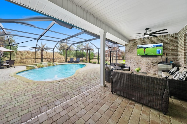 view of swimming pool with ceiling fan, an outdoor hangout area, glass enclosure, and a patio area