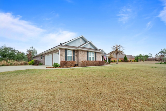 624 Tournament Ln, Freeport, FL 32439 - view of front of property featuring driveway, a front yard, a garage, and brick siding