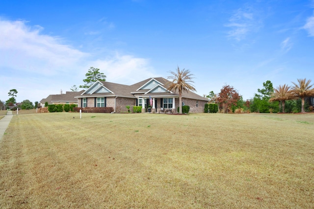 624 Tournament Ln, Freeport, FL 32439 - view of front of house with a front lawn and brick siding