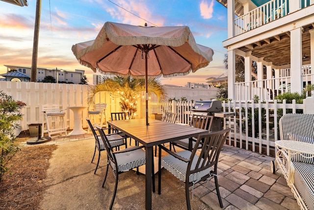 view of patio terrace at dusk