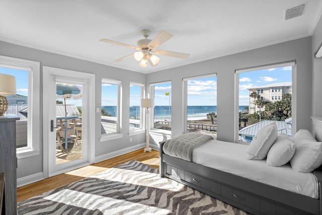 bedroom with access to outside, ceiling fan, crown molding, a water view, and light hardwood / wood-style flooring