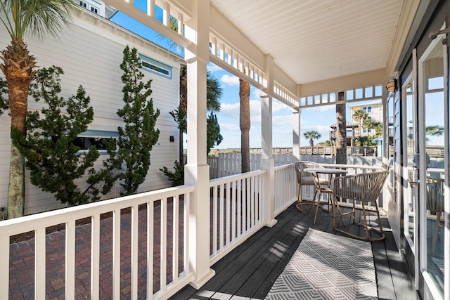 wooden deck featuring covered porch