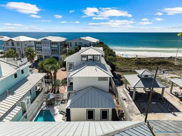 drone / aerial view featuring a view of the beach and a water view