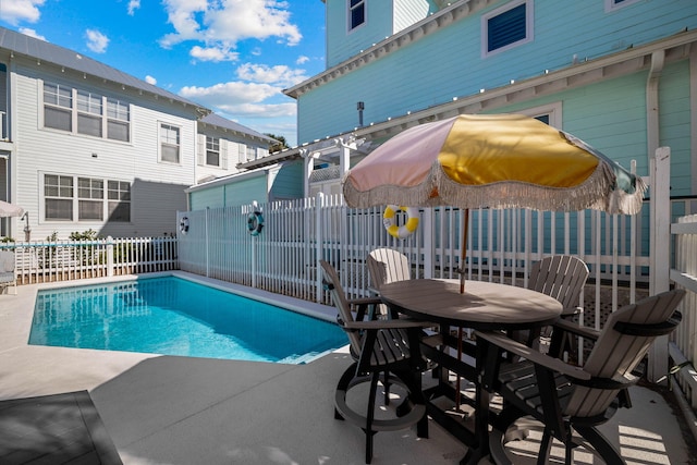 view of swimming pool with a patio