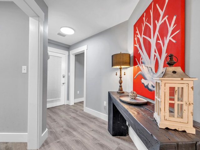 hallway featuring hardwood / wood-style floors