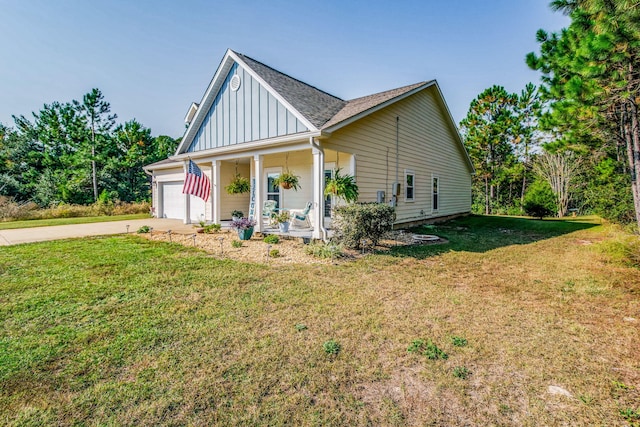 view of front facade with a front yard and a porch