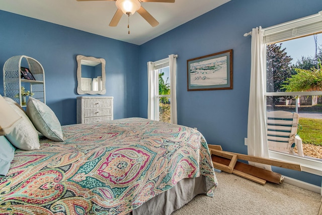 carpeted bedroom with ceiling fan