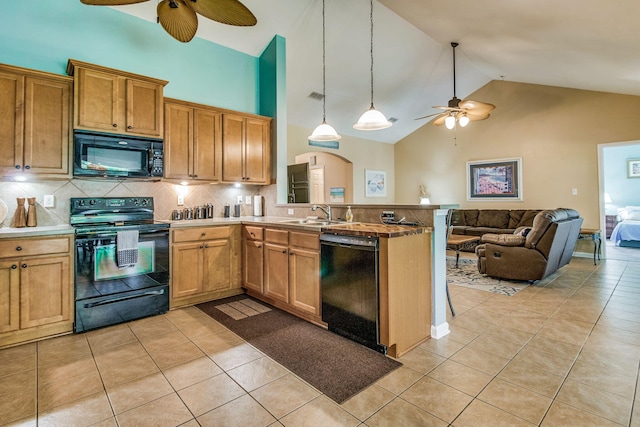 kitchen featuring kitchen peninsula, black appliances, decorative light fixtures, high vaulted ceiling, and light tile patterned flooring