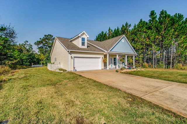 view of front of house featuring a front lawn, a porch, and a garage