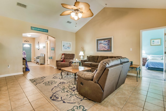 living room featuring ceiling fan, light tile patterned flooring, and high vaulted ceiling