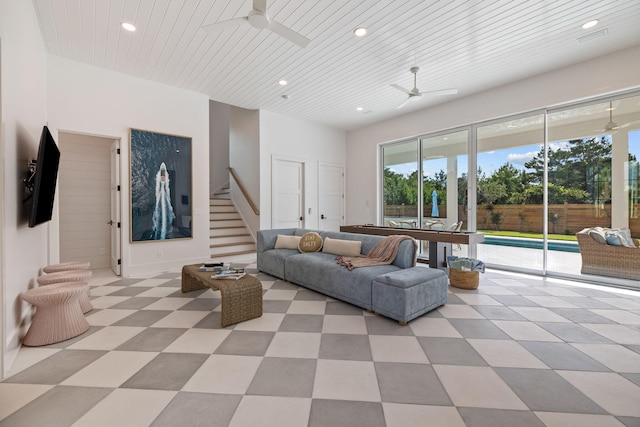 unfurnished living room with ceiling fan and wood ceiling