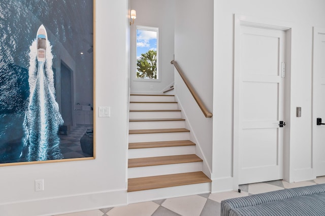 stairs with tile patterned flooring