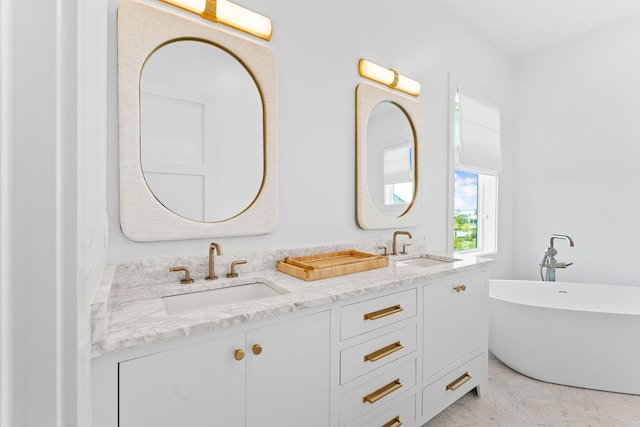 bathroom featuring a washtub and vanity