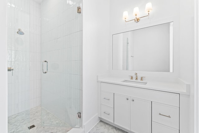 bathroom with vanity and an enclosed shower