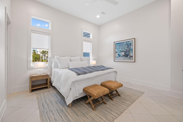 tiled bedroom featuring ceiling fan