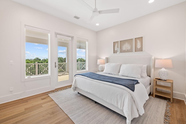 bedroom featuring access to outside, ceiling fan, and hardwood / wood-style floors