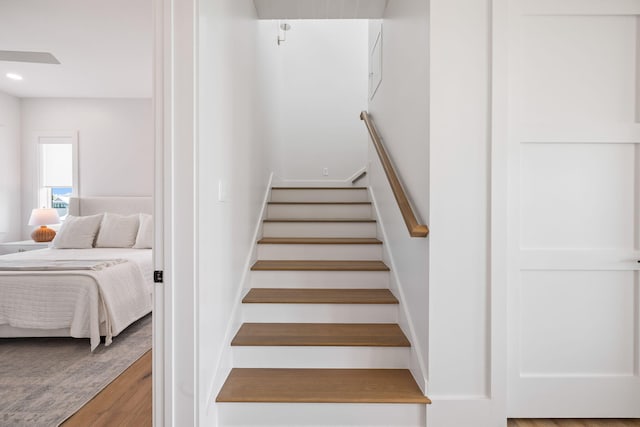 stairs with wood-type flooring