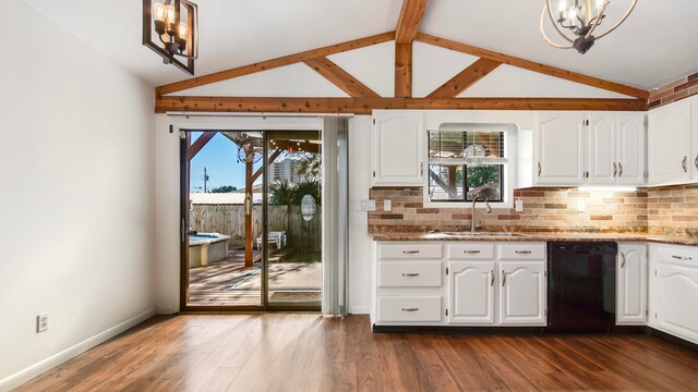 kitchen with lofted ceiling with beams, light stone counters, white cabinetry, and black dishwasher