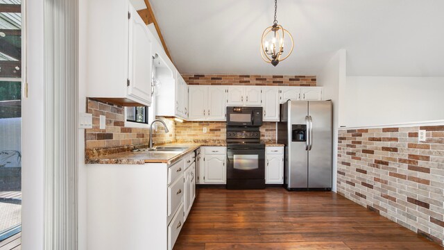 kitchen with pendant lighting, white cabinetry, dark wood-type flooring, and black appliances