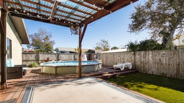 view of patio featuring a swimming pool side deck and a pergola