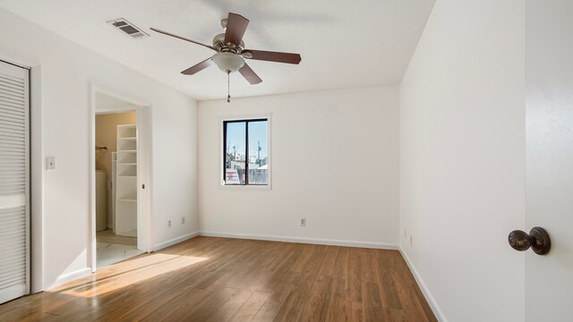 unfurnished bedroom with ceiling fan and hardwood / wood-style floors