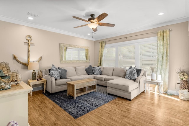 living room featuring crown molding, ceiling fan, and wood-type flooring