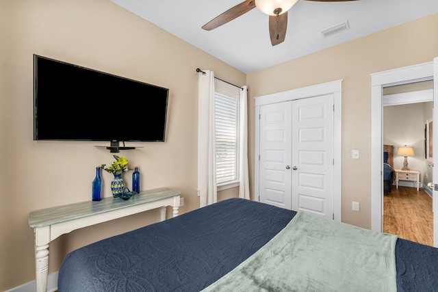 bedroom featuring hardwood / wood-style floors and ceiling fan