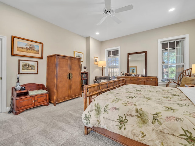 bedroom featuring ceiling fan and light colored carpet