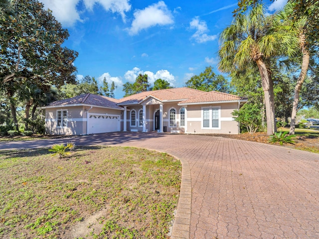 view of front of property featuring a garage