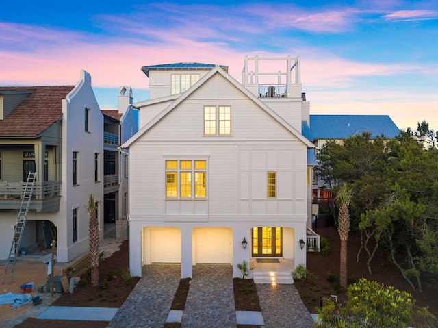 view of front of property featuring french doors and a garage