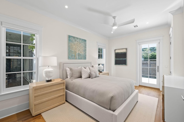 bedroom with light wood-type flooring, access to outside, ceiling fan, and crown molding