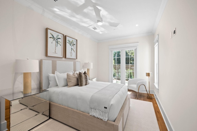 bedroom featuring ceiling fan, crown molding, and wood-type flooring