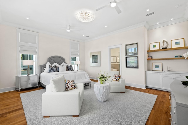 bedroom featuring multiple windows, ceiling fan, crown molding, and dark wood-type flooring