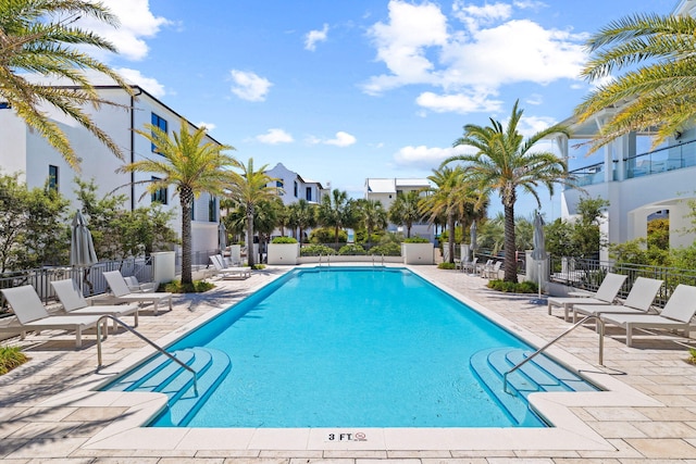 view of swimming pool with a patio