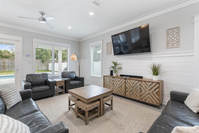 326 E Lakeshore Dr, Panama City Beach, FL 32413 - living area with ornamental molding, a ceiling fan, recessed lighting, and a wainscoted wall