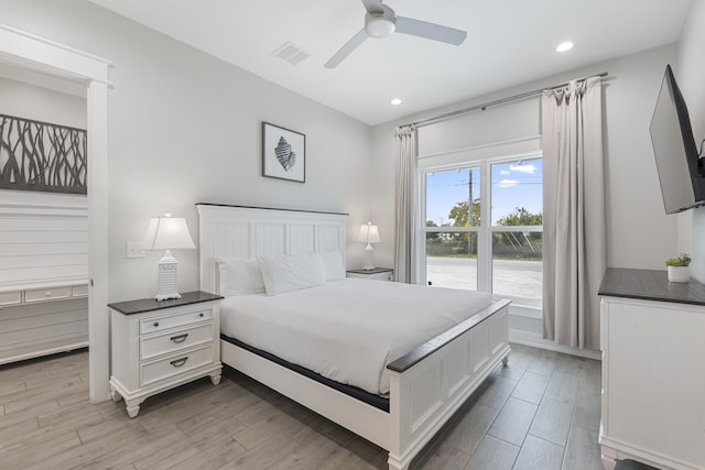 bedroom featuring light wood-type flooring and ceiling fan