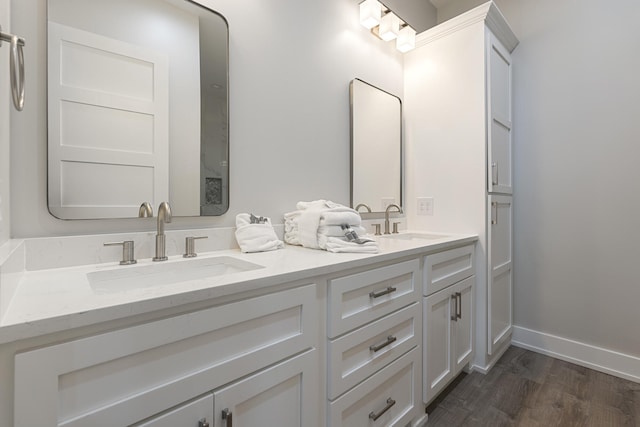 bathroom with hardwood / wood-style floors and vanity