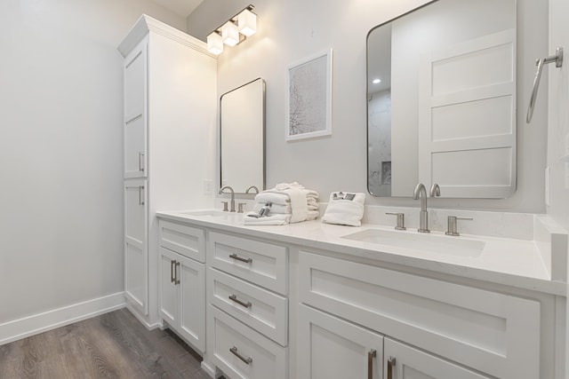 326 E Lakeshore Dr, Panama City Beach, FL 32413 - bathroom featuring double vanity and wood finished floors