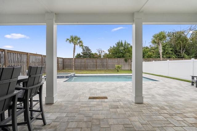 326 E Lakeshore Dr, Panama City Beach, FL 32413 - view of pool featuring a patio, a fenced backyard, and a pool with connected hot tub