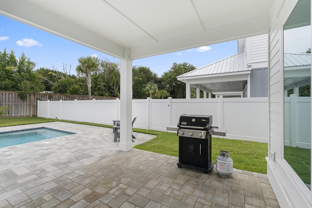 326 E Lakeshore Dr, Panama City Beach, FL 32413 - fenced backyard featuring a patio area and a grill