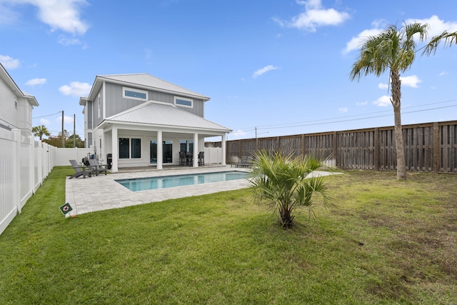 326 E Lakeshore Dr, Panama City Beach, FL 32413 - rear view of property with a metal roof, a fenced backyard, a patio, and board and batten siding