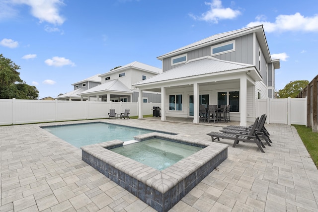 326 E Lakeshore Dr, Panama City Beach, FL 32413 - view of pool featuring a patio area, a gazebo, a fenced backyard, and a pool with connected hot tub