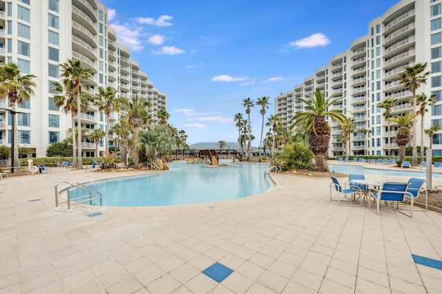 view of swimming pool featuring a patio area